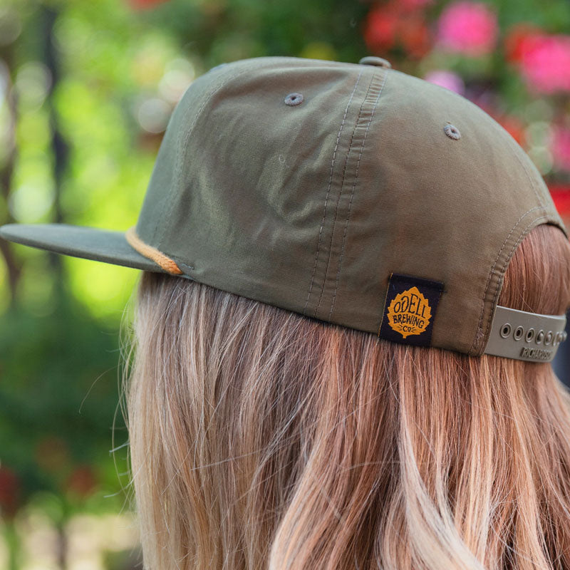 green hat with black and gold odell logo loop tag