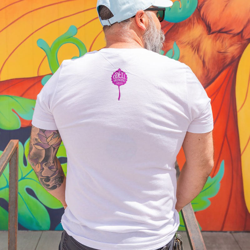 Leaf logo on back of SIppin Tropical Art on white tee