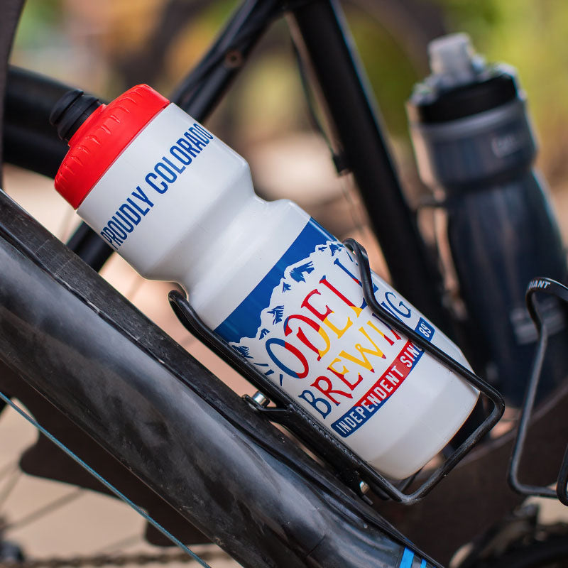 Water bottle with mountains and Odell Brewing text with the Colorado flag inside the lettering.