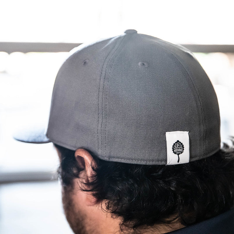 Back of a grey hat with the Odell Brewing logo