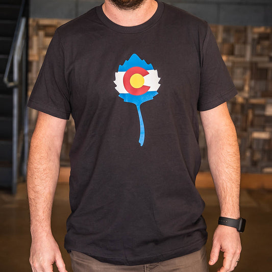 Front of Odell Colorado flag t-shirt with the Colorado flag filling up the Odell logo