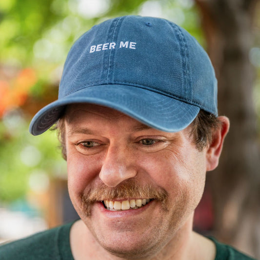 Machine washed blue dad hat, with Beer Me text on front