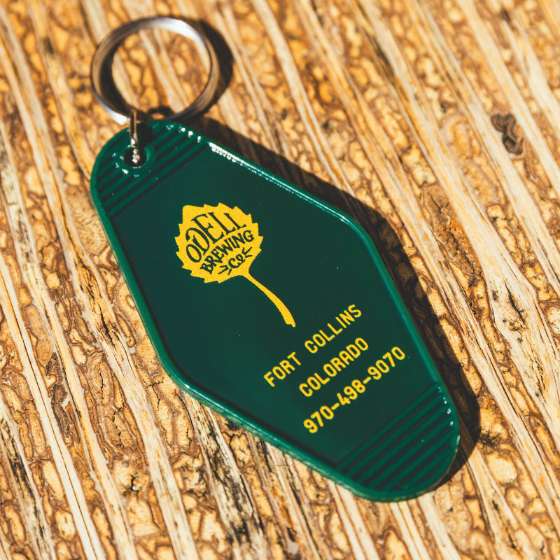hotel style key chain gold on green