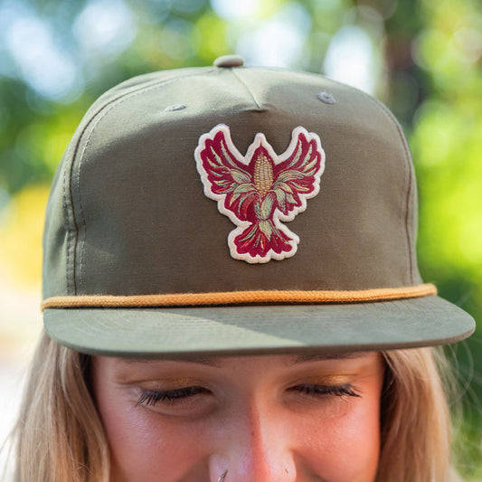 Kernel bird logo green hat with gold rope