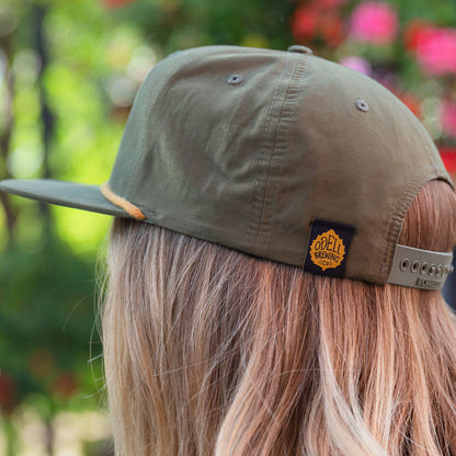green hat with black and gold odell logo loop tag