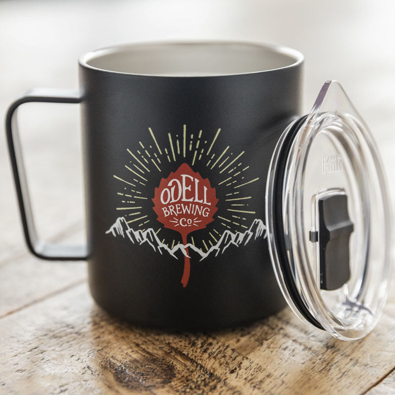 Black Miir mug with Odell Leaf logo, mountain range and rays