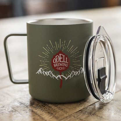 Green Miir mug with Odell Leaf logo, mountain range and rays
