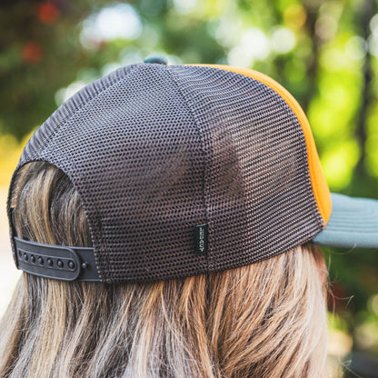 Wine Project Pour Choices foam trucker hat, Magenta text on gold background