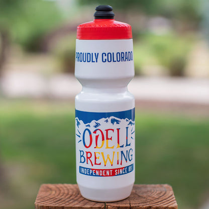 White water bottle with mountains and Odell Brewing text with Colorado flag colors