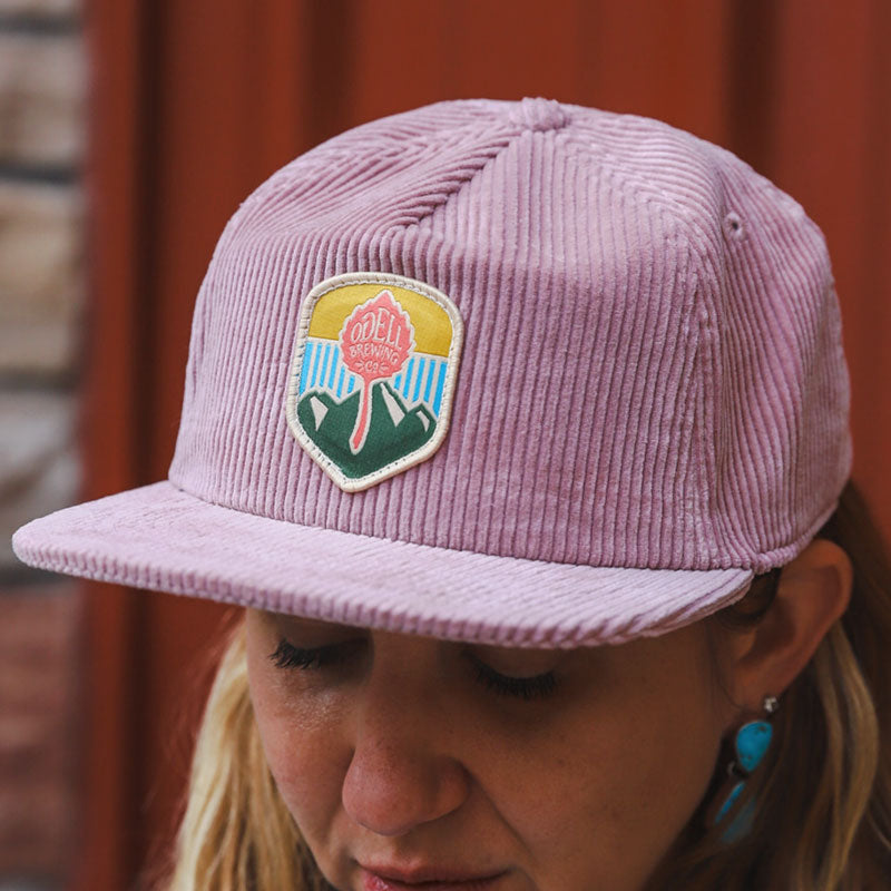 Pink corduroy hat with odell patch