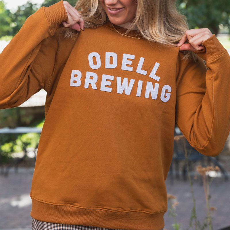 Rust Crewneck Sweat shirt with cut & sew Odell Brewing letters 