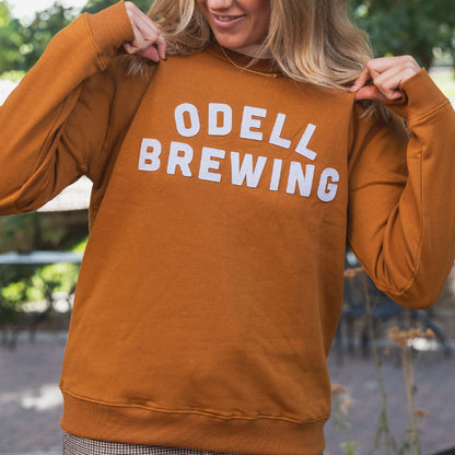 Rust Crewneck Sweat shirt with cut & sew Odell Brewing letters 